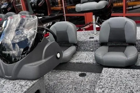 Slide: The Image of 2026 Tracker Pro 170 boat interior with gray seating and steering console. - 5