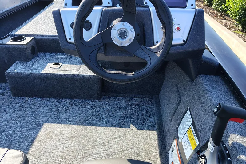 Slide: The Image of 2026 Tracker Pro Team 190 boat interior with steering wheel and control panel. - 5