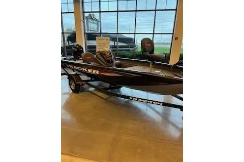 Slide: The Image of 2026 Tracker Pro Team 175 Crappie Edition boat displayed indoors. - 7
