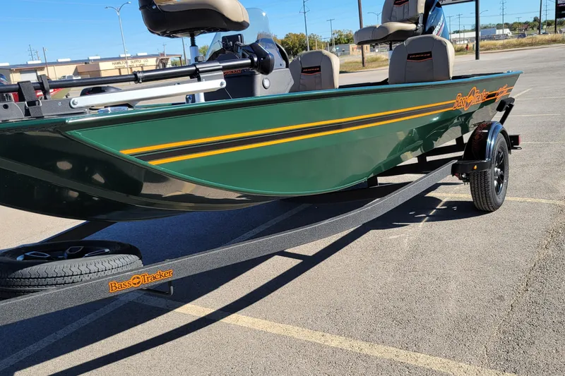Slide: The Image of 2026 Tracker Bass Tracker Classic Limited boat on trailer in parking lot. - 2