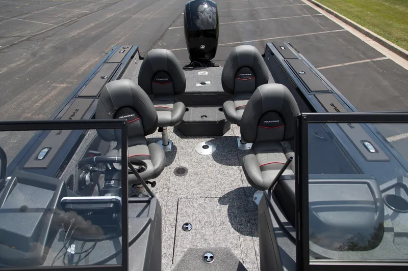 Slide: The Image of 2026 Tracker Targa V-18 WT boat interior with four seats and steering console. - 3