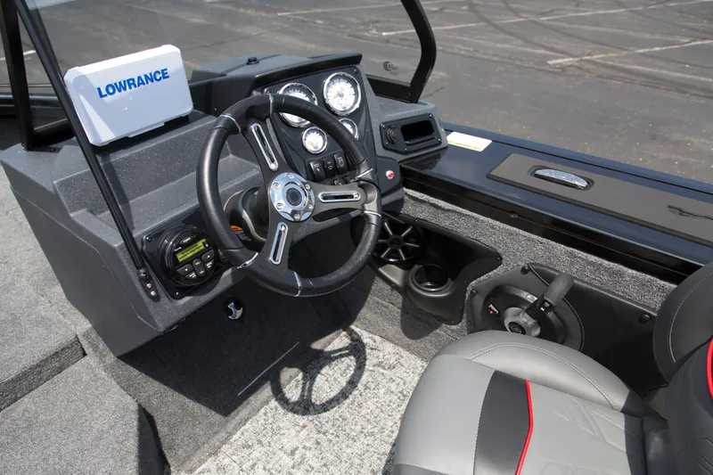 Slide: The Image of 2026 Tracker Targa V-18 WT boat dashboard with steering wheel and Lowrance electronics. - 5