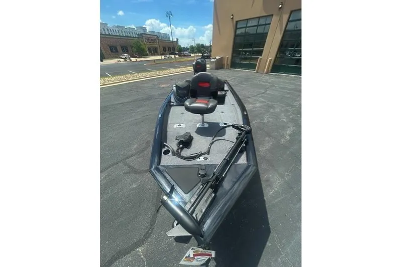 Slide: The Image of 2026 Tracker Pro Team 175 Crappie Edition boat parked outdoors, showcasing sleek design. - 4