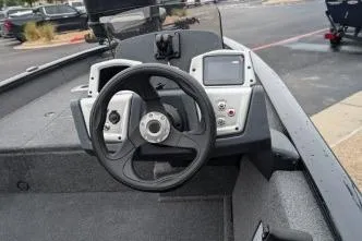 Slide: The Image of 2026 Tracker Pro Team 175 Crappie Edition boat dashboard with steering wheel and controls. - 6
