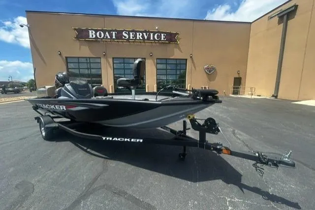 Slide: The Image of 2026 Tracker Pro Team 175 Crappie Edition boat outside service center. - 2