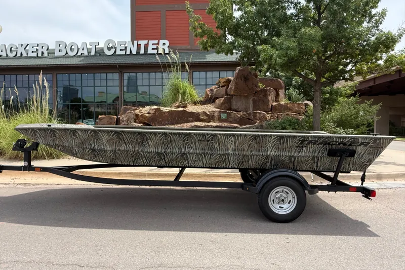 The Image of 2026 Tracker Grizzly 1860 Utility boat on trailer outside Tracker Boat Center. - 0