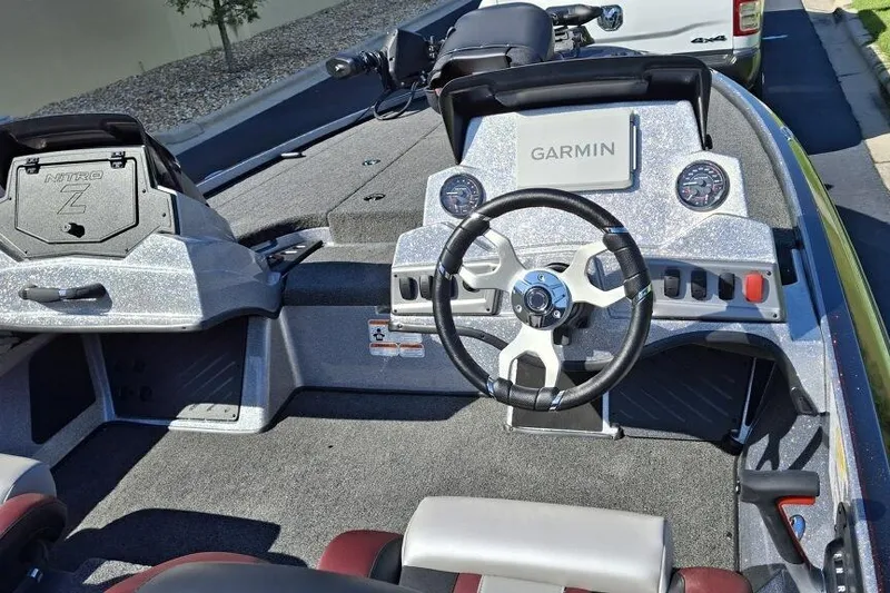 Slide: The Image of 2026 Nitro Z18 Pro boat dashboard with Garmin system and steering wheel. - 3