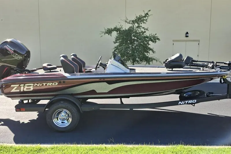Slide: The Image of 2026 Nitro Z18 Pro boat on trailer, side view, parked outdoors. - 4