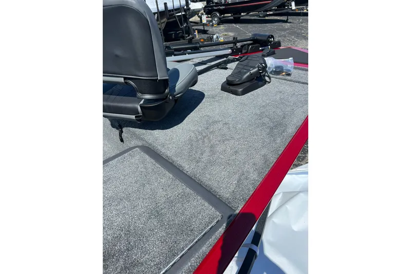 Slide: The Image of 2026 Tracker Bass Tracker Classic XL boat interior with gray carpet and seating. - 11