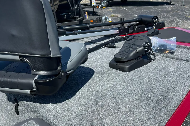 Slide: The Image of 2026 Tracker Bass Tracker Classic XL boat deck with seat and trolling motor pedal. - 6