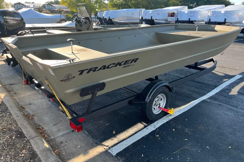 The Image of 2026 Tracker GRIZZLY 2072 Utility boat on trailer, parked outdoors. - 0