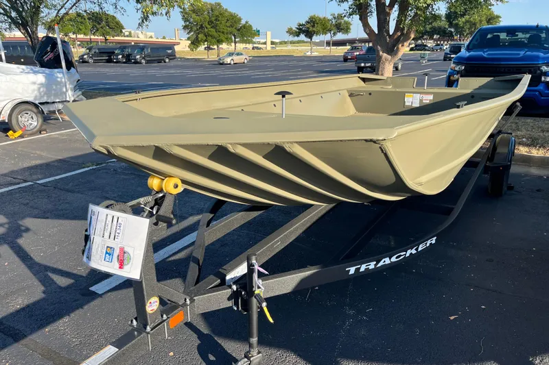 Slide: The Image of 2026 Tracker GRIZZLY 2072 Utility boat on trailer in parking lot. - 2