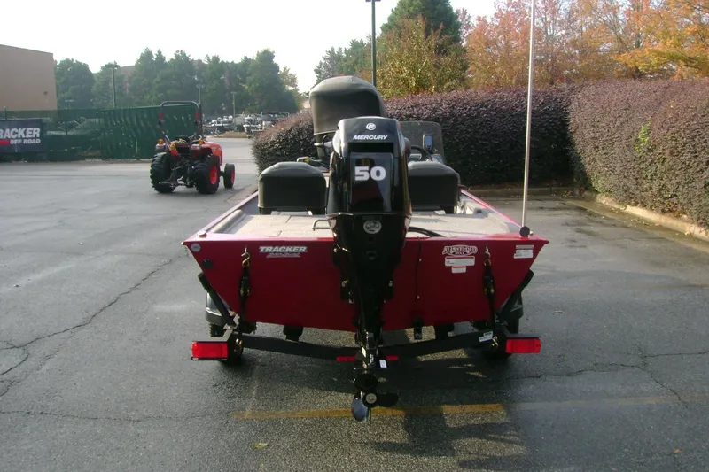 Slide: The Image of 2026 Tracker Bass Tracker Classic XL boat with Mercury 50 engine in parking lot. - 31