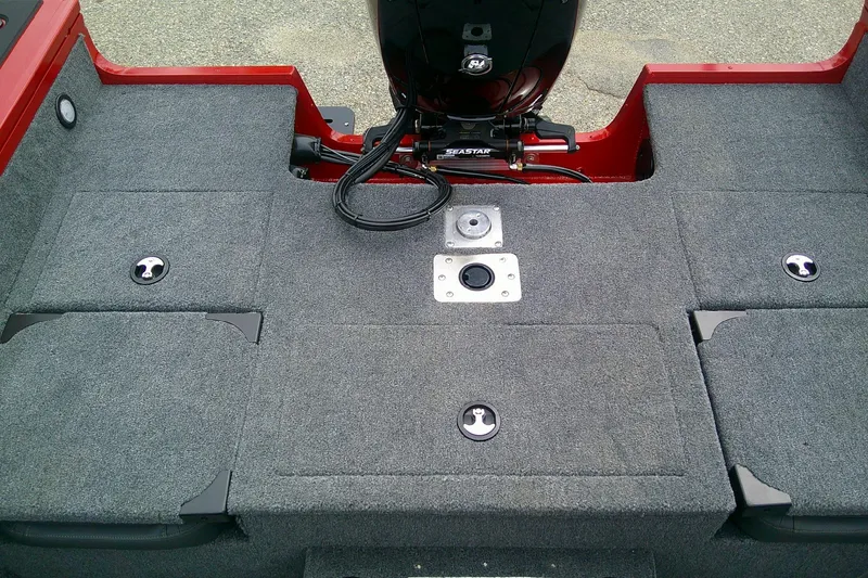 Slide: The Image of 2026 Tracker Targa V-18 Combo boat interior with carpeted deck and motor mount. - 8