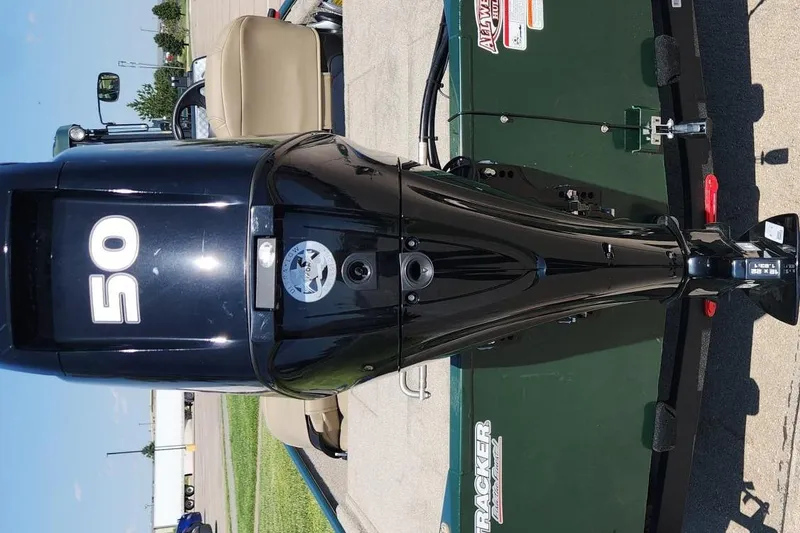 Slide: The Image of 2026 Tracker Bass Tracker Classic Limited with 50 HP outboard motor, parked on a trailer. - 5
