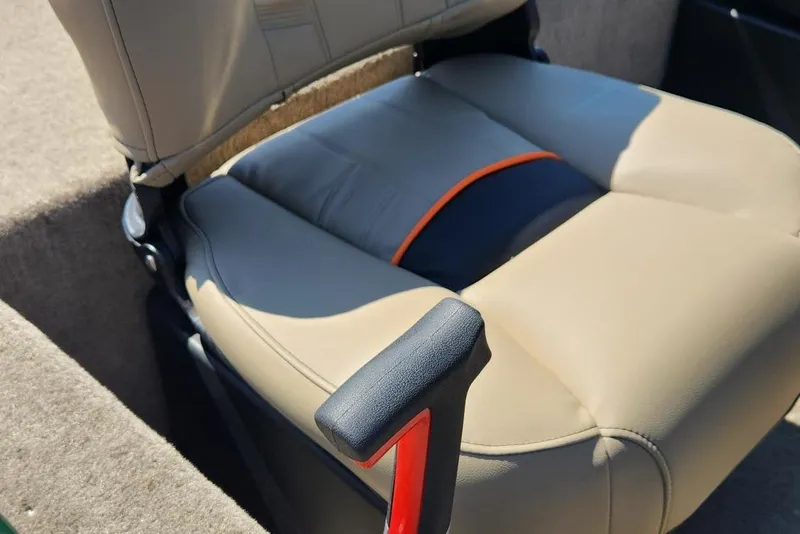 Slide: The Image of 2026 Tracker Bass Tracker Classic Limited boat seat with beige upholstery and armrest. - 7