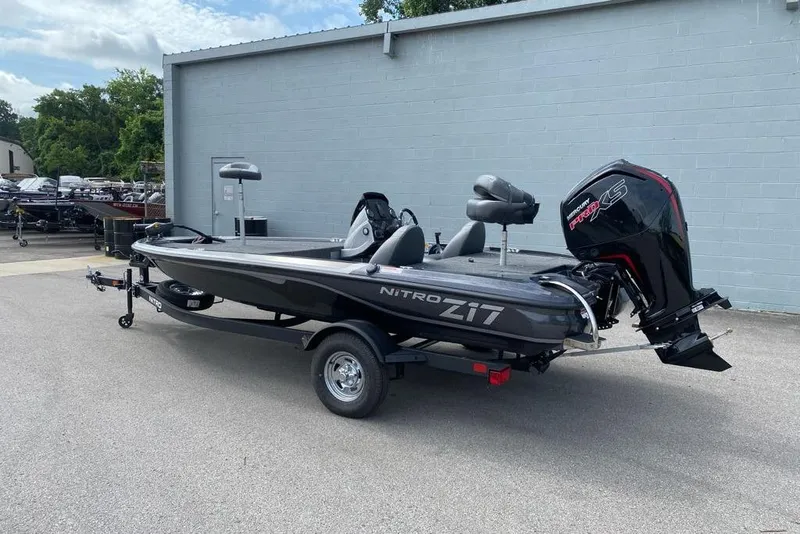 Slide: The Image of 2026 Nitro Z17 boat with powerful outboard motor, parked on a trailer. - 98