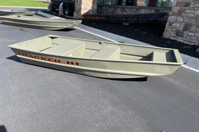 The Image of 2026 Tracker Grizzly 10 Jon boat displayed outdoors on pavement. - 0