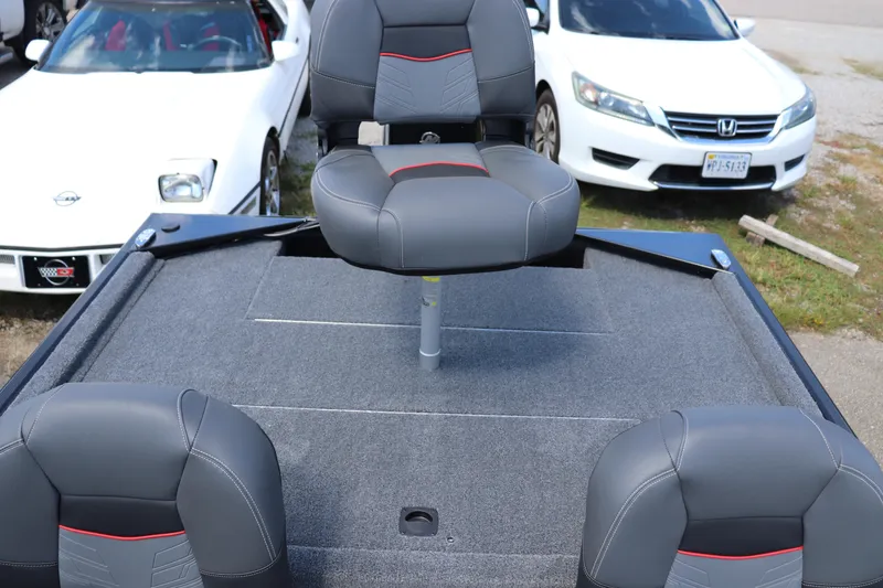 Slide: The Image of 2026 Tracker Bass Tracker Classic XL boat interior with gray seats and carpeted deck. - 10