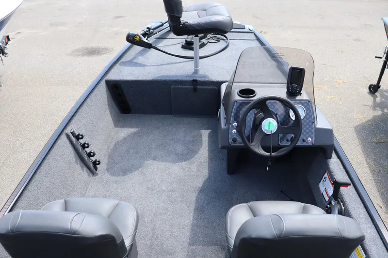Slide: The Image of 2026 Tracker Bass Tracker Classic XL boat interior with steering console and seating. - 11