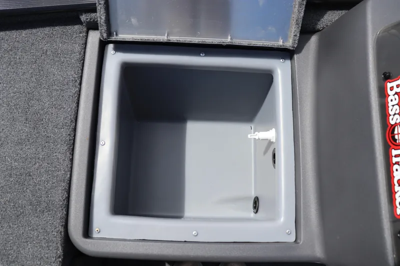 Slide: The Image of 2026 Tracker Bass Tracker Classic XL livewell interior, featuring gray finish and drainage system. - 5
