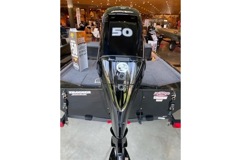 Slide: The Image of 2026 Tracker Bass Tracker Classic XL with Mercury 50 engine in showroom. - 2