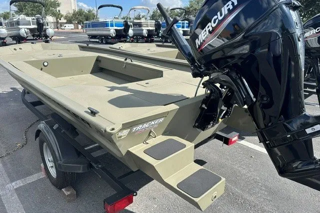 Slide: The Image of 2026 Tracker Grizzly 1654 T Sportsman boat with Mercury engine on trailer. - 9