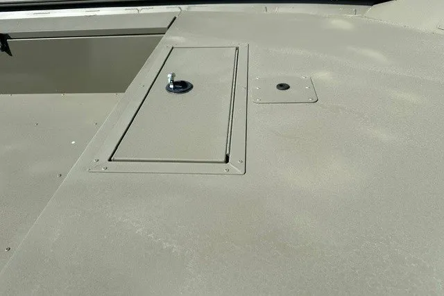 Slide: The Image of 2026 Tracker Grizzly 1654 T Sportsman boat deck with storage compartment. - 6