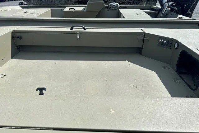 Slide: The Image of 2026 Tracker Grizzly 1654 T Sportsman boat interior, showcasing spacious deck and storage compartments. - 10