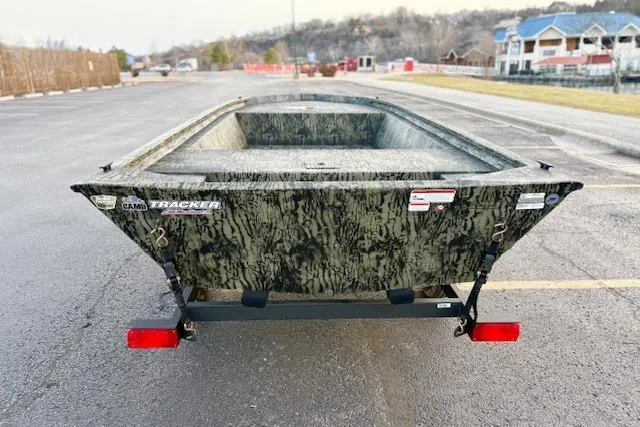 Slide: The Image of 2026 Tracker Grizzly 1648 Utility boat on trailer, parked in outdoor setting. - 5