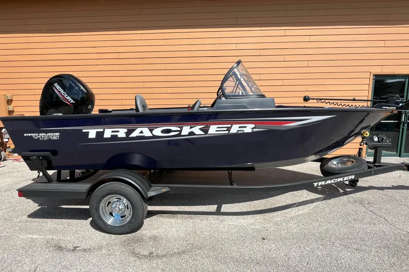 The Image of 2026 Tracker Pro Guide V-175 WT boat on trailer, parked outdoors. - 0