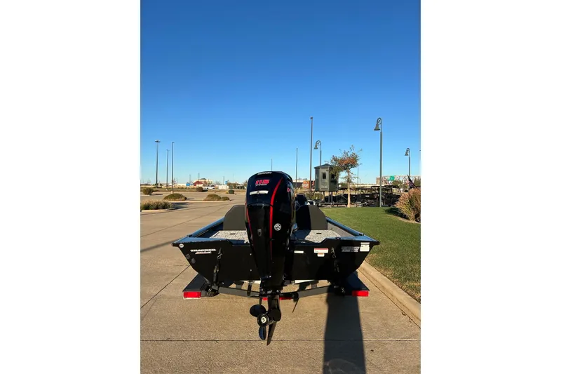 Slide: The Image of 2026 Tracker Pro Team 190 boat with outboard motor on a sunny day. - 3
