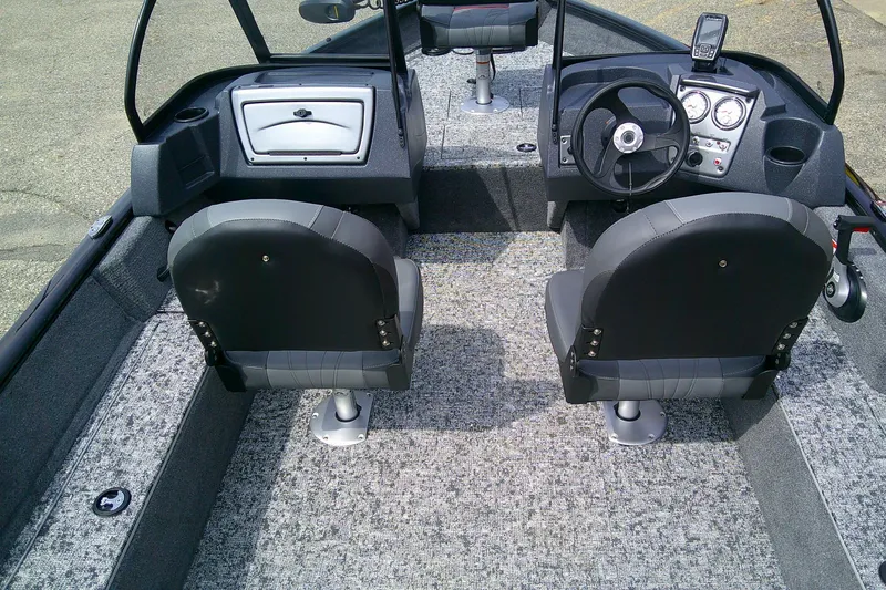 Slide: The Image of 2026 Tracker Pro Guide V-16 WT boat interior with dual seats and steering console. - 6