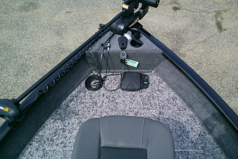 Slide: The Image of 2026 Tracker Pro Guide V-16 WT boat interior with trolling motor and foot pedal. - 7