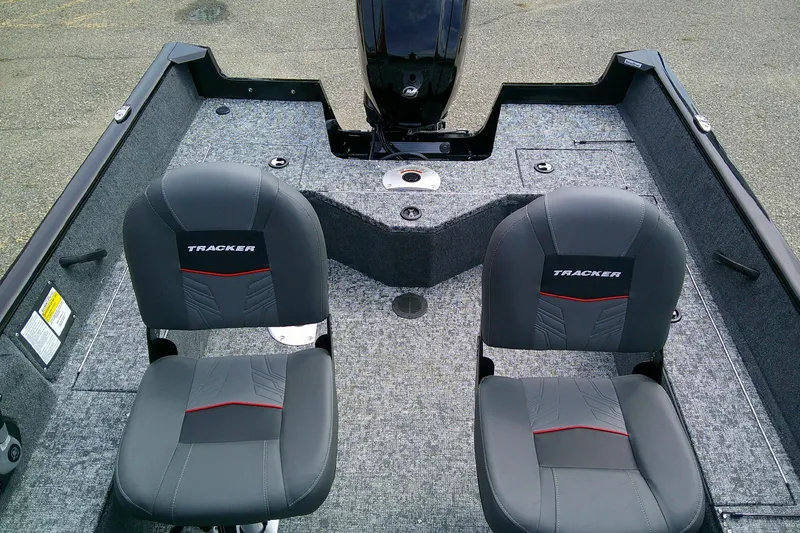 Slide: The Image of 2026 Tracker Pro Guide V-16 WT boat interior with two seats and carpeted flooring. - 8