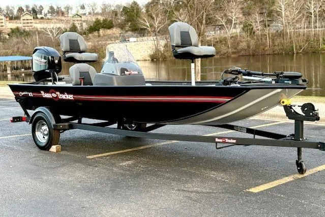 Slide: The Image of 2026 Tracker Bass Tracker Classic XL boat on trailer by a lake. - 80