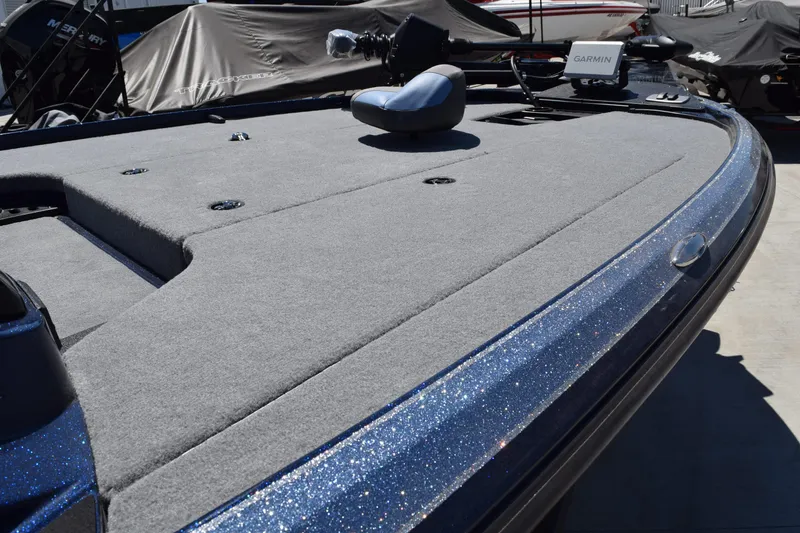 Slide: The Image of 2026 Nitro Z18 Pro fishing boat in a garage, featuring sleek design and comfortable seating. - 2