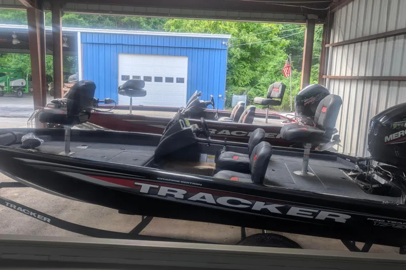 The Image of 2026 Tracker Pro Team 175 Crappie Edition boat in a garage setting. - 0