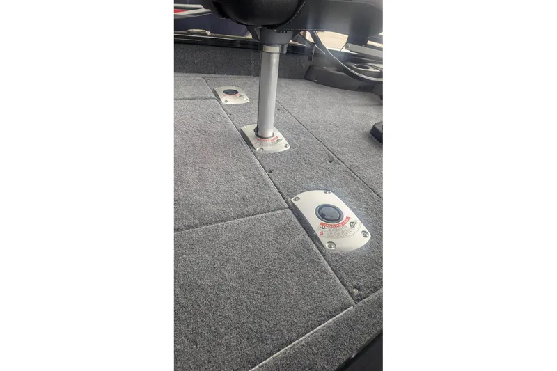 Slide: The Image of 2026 Tracker Pro Team 175 Crappie Edition boat interior with carpeted flooring. - 7