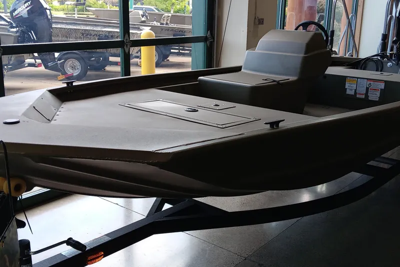 The Image of 2026 Tracker Grizzly 1648 SC boat on trailer, displayed outdoors. - 0