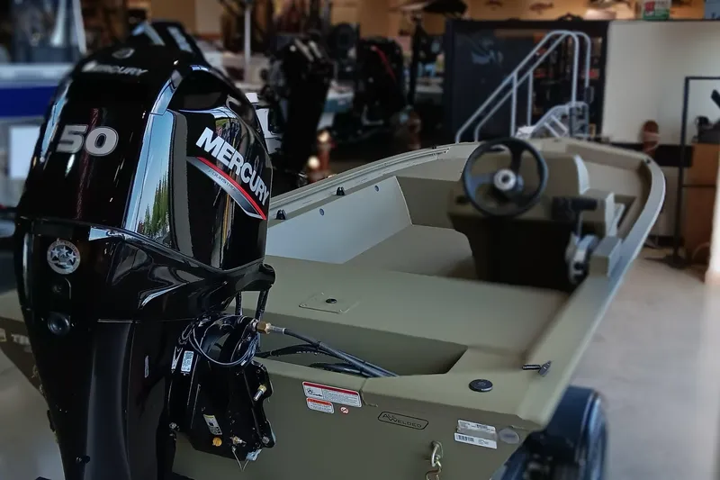 Slide: The Image of 2026 Tracker Grizzly 1648 SC boat, spacious deck, outdoor display. - 4