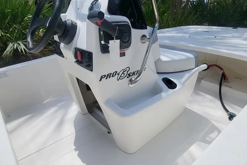 Slide: The Image of 2026 Mako Pro Skiff 13 CC boat in a sunny outdoor setting. - 1