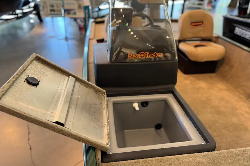 Slide: The Image of 2026 Tracker Bass Tracker Classic Limited boat interior with open storage compartment. - 2
