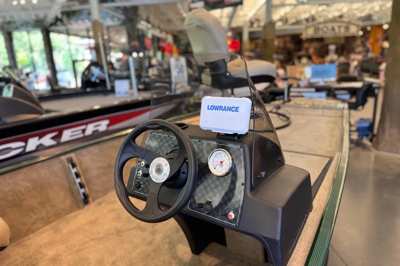Slide: The Image of 2026 Tracker Bass Tracker Classic Limited boat dashboard with steering wheel and Lowrance device. - 3