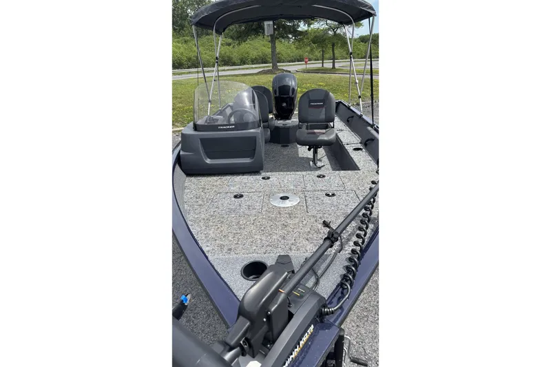 Slide: The Image of 2026 Tracker Pro Guide V-16 SC boat interior with seating and controls. - 2