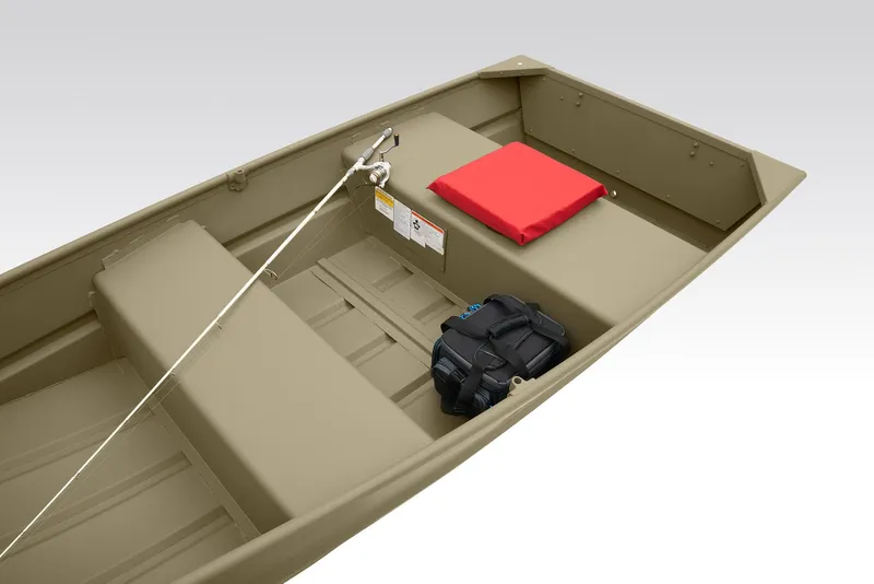 Slide: The Image of 2026 Tracker Grizzly 10 Jon boat on pavement, showcasing interior seating and design. - 5