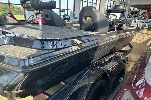 Slide: The Image of 2026 Nitro Z20 XL Pro boat in showroom, featuring sleek black design and dual seats. - 4