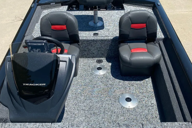 Slide: The Image of 2026 Tracker Pro Team 175 Crappie Edition boat interior with black and red seats. - 4