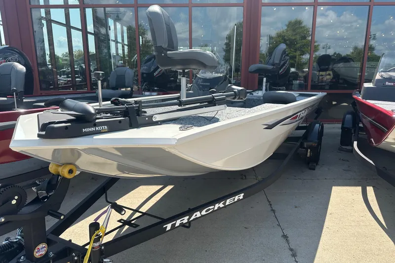 The Image of 2026 Tracker Pro 170 boat on trailer, displayed outdoors with Minn Kota motor. - 0