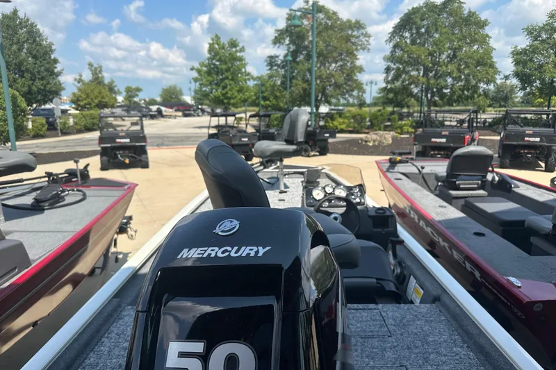 Slide: The Image of 2026 Tracker Pro 170 boat with Mercury 50 engine, parked outdoors. - 2